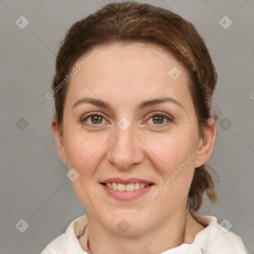 Joyful white adult female with short  brown hair and grey eyes