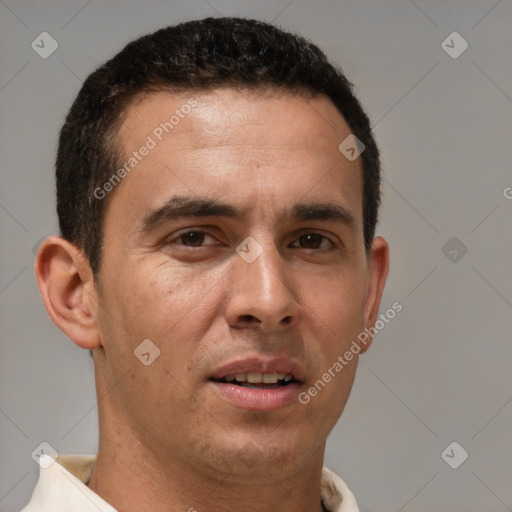 Joyful white adult male with short  brown hair and brown eyes