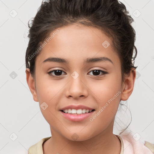 Joyful white child female with short  brown hair and brown eyes