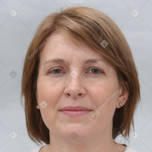 Joyful white adult female with medium  brown hair and grey eyes