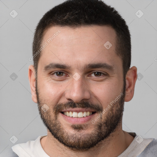 Joyful white young-adult male with short  brown hair and brown eyes