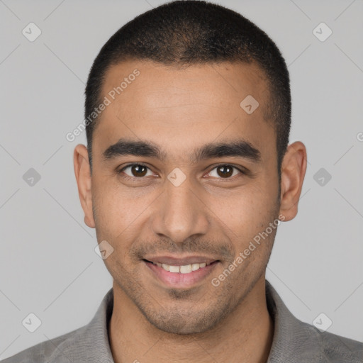 Joyful white young-adult male with short  black hair and brown eyes