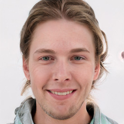 Joyful white young-adult male with medium  brown hair and blue eyes