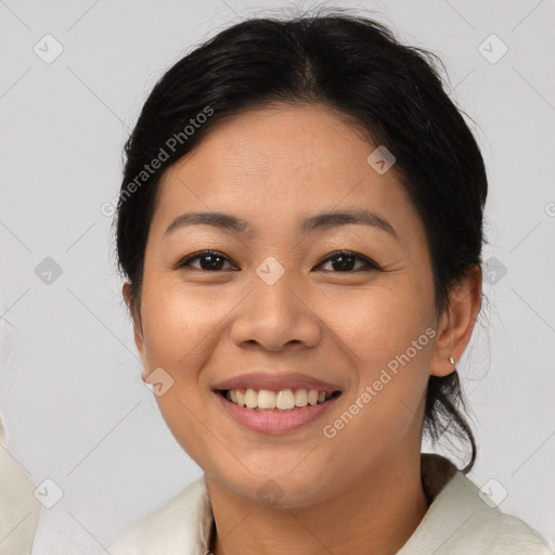 Joyful asian young-adult female with medium  black hair and brown eyes