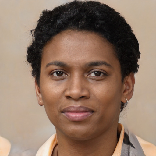 Joyful latino young-adult female with short  black hair and brown eyes