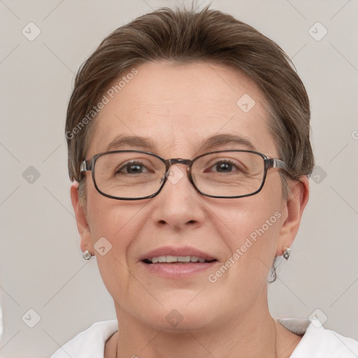 Joyful white adult female with short  brown hair and grey eyes