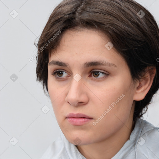 Neutral white young-adult female with medium  brown hair and brown eyes