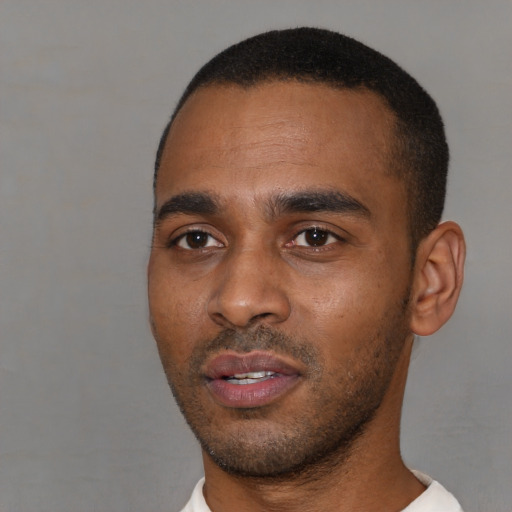 Neutral latino young-adult male with short  black hair and brown eyes