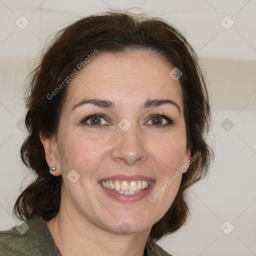 Joyful white adult female with medium  brown hair and green eyes