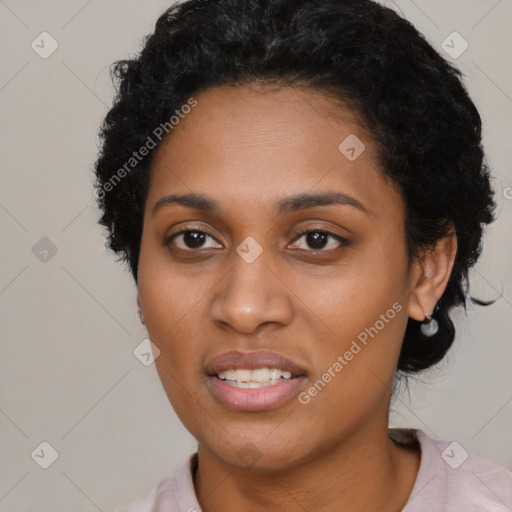 Joyful black young-adult female with short  black hair and brown eyes