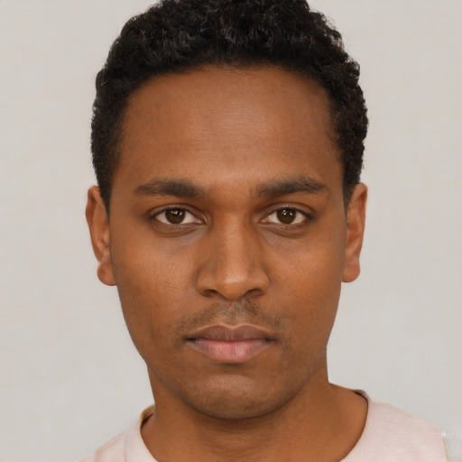 Neutral black young-adult male with short  black hair and brown eyes