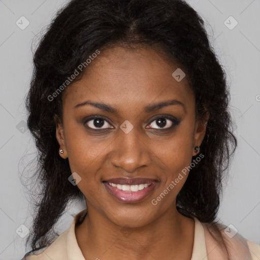 Joyful black young-adult female with long  brown hair and brown eyes