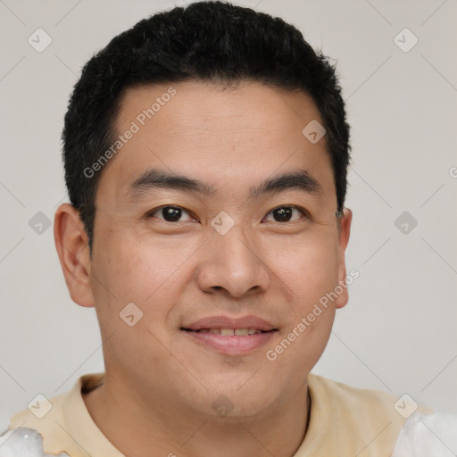 Joyful latino young-adult male with short  black hair and brown eyes