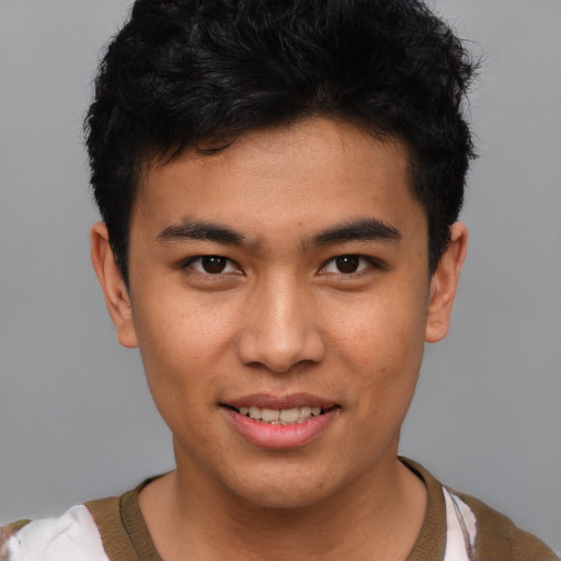 Joyful asian young-adult male with short  black hair and brown eyes