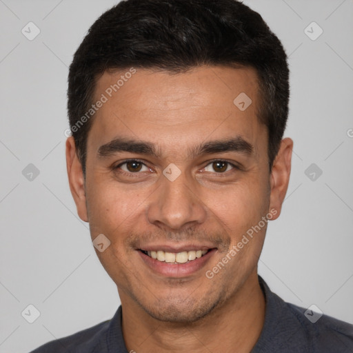 Joyful white young-adult male with short  black hair and brown eyes