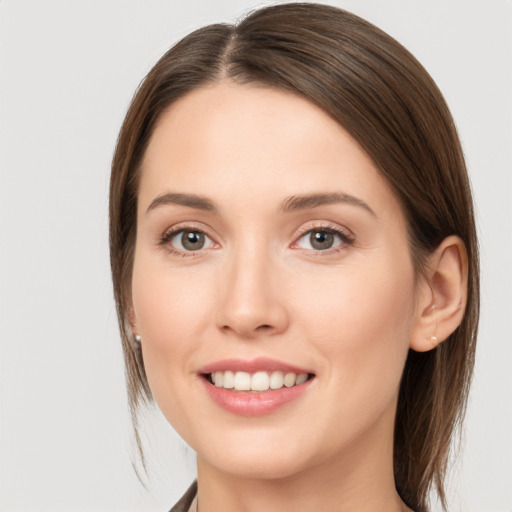 Joyful white young-adult female with medium  brown hair and brown eyes