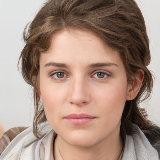 Neutral white young-adult female with medium  brown hair and blue eyes