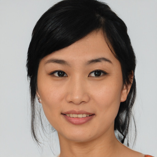 Joyful asian young-adult female with medium  black hair and brown eyes