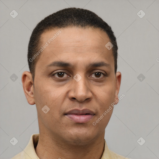 Joyful latino young-adult male with short  brown hair and brown eyes