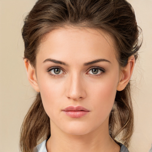 Neutral white young-adult female with medium  brown hair and brown eyes