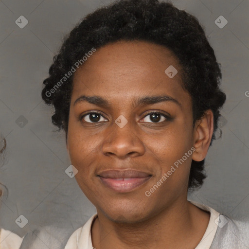 Joyful black young-adult female with short  black hair and brown eyes