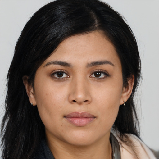 Joyful asian young-adult female with long  black hair and brown eyes