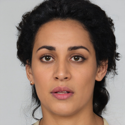 Neutral latino young-adult female with long  black hair and brown eyes