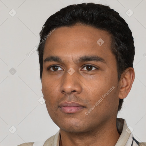 Neutral latino young-adult male with short  black hair and brown eyes