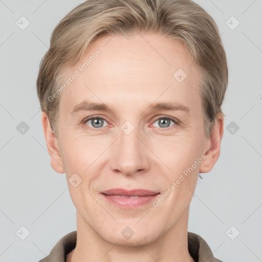 Joyful white adult male with short  brown hair and grey eyes