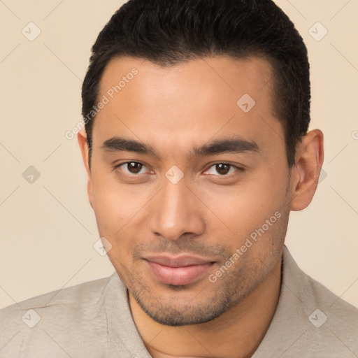 Joyful latino young-adult male with short  brown hair and brown eyes