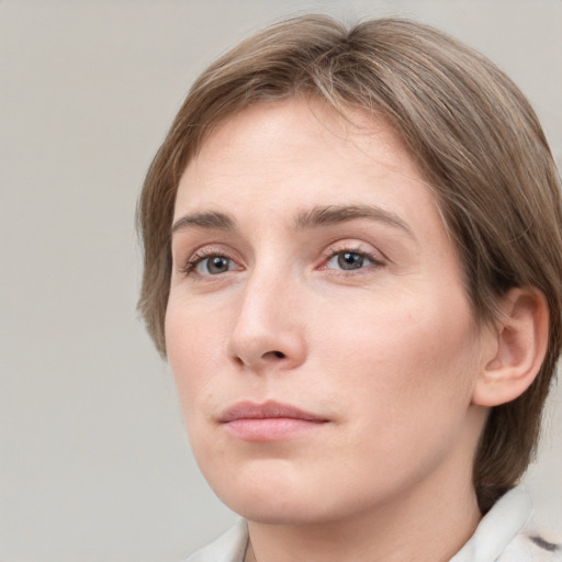 Neutral white young-adult female with medium  brown hair and grey eyes