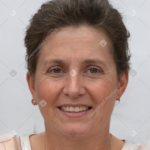 Joyful white adult female with short  brown hair and brown eyes