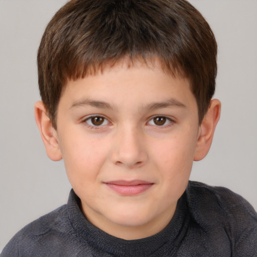 Joyful white child male with short  brown hair and brown eyes