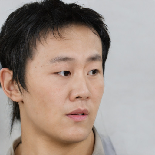 Neutral asian young-adult male with short  black hair and brown eyes