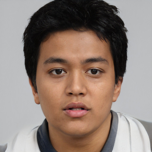 Neutral asian young-adult male with short  black hair and brown eyes