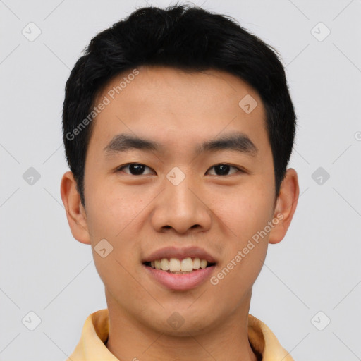 Joyful asian young-adult male with short  black hair and brown eyes