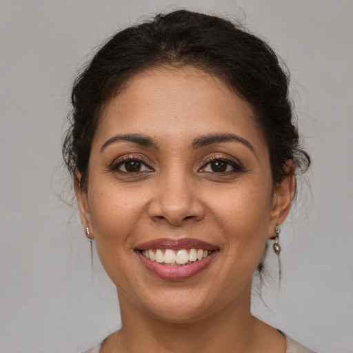 Joyful white young-adult female with medium  brown hair and brown eyes