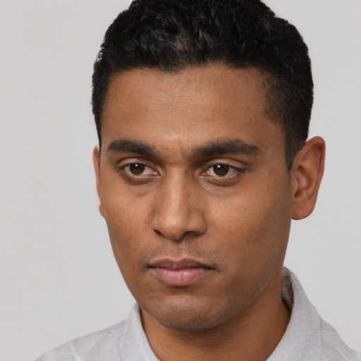 Neutral latino young-adult male with short  black hair and brown eyes