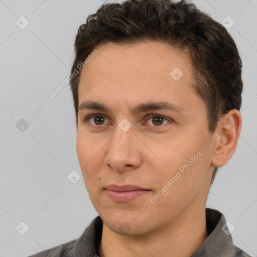 Joyful white adult male with short  brown hair and brown eyes