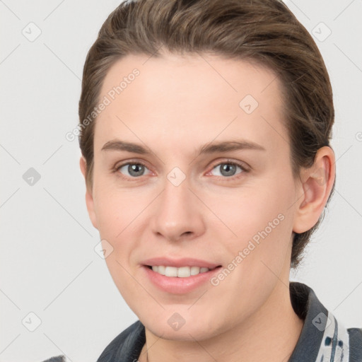 Joyful white young-adult female with short  brown hair and grey eyes