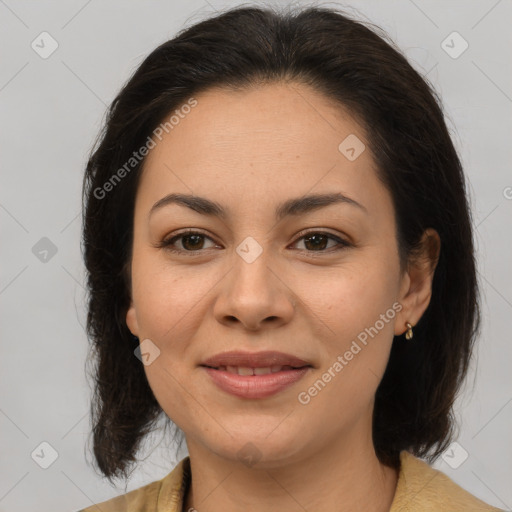 Joyful latino young-adult female with medium  brown hair and brown eyes