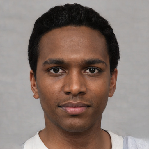Neutral black young-adult male with short  black hair and brown eyes
