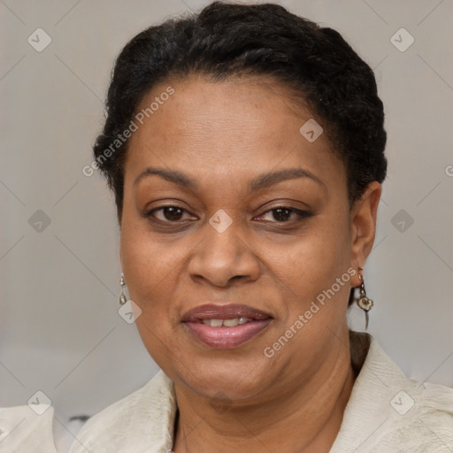 Joyful black adult female with short  brown hair and brown eyes