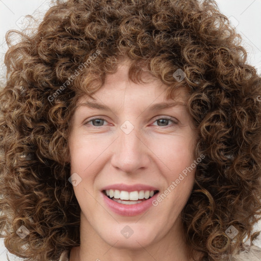 Joyful white young-adult female with medium  brown hair and green eyes