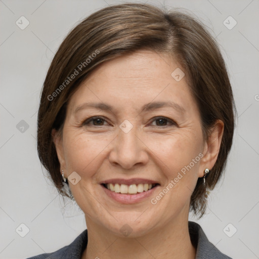 Joyful white adult female with medium  brown hair and brown eyes