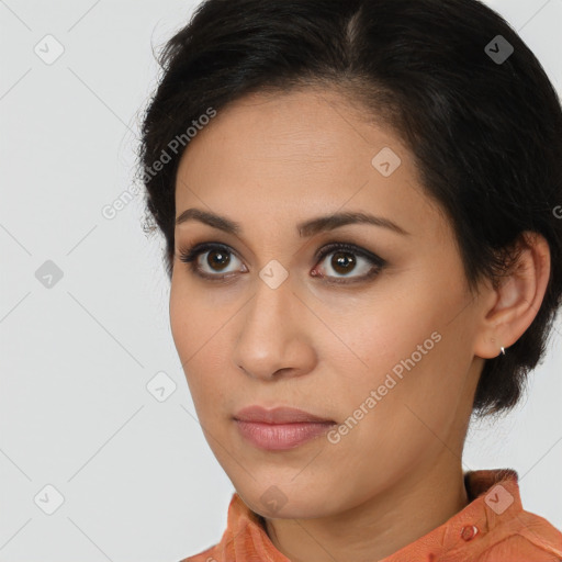 Joyful latino young-adult female with medium  brown hair and brown eyes