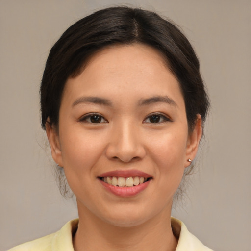 Joyful white young-adult female with medium  brown hair and brown eyes