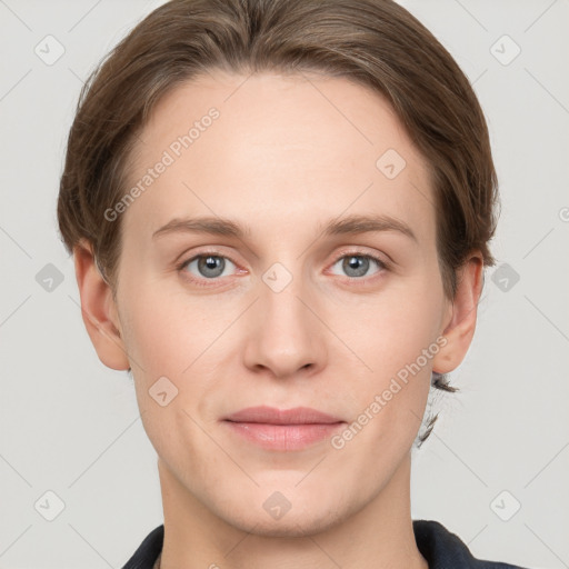 Joyful white young-adult female with short  brown hair and grey eyes