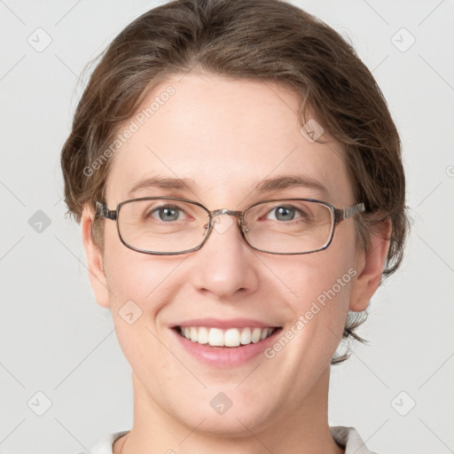 Joyful white young-adult female with medium  brown hair and grey eyes