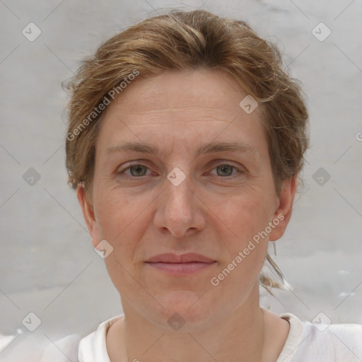 Joyful white adult female with short  brown hair and brown eyes